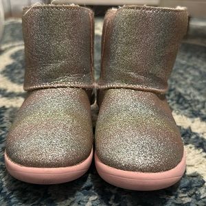 Ugg kids pink glitter boots.